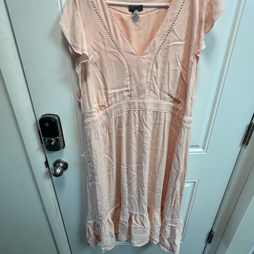 Light Pink V-Neck Dress with Ruffle Hem